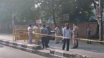 Police personnel keep vigil after a blast was reported near the CRPF school at Prashant Vihar in Delhi on Sunday. (PTI) Police personnel keep vigil after a blast was reported near the CRPF school at Prashant Vihar in Delhi on Sunday. (PTI)