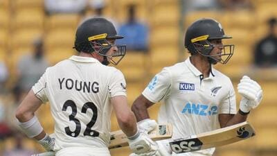 Rachin Ravindra (R), New Zealand’s chief batting architect in the first Test against India, celebrates the winning run with partner Will Young at the M Chinnaswamy Stadium in Bengaluru on Sunday. NZ won by eight wickets. (PTI)