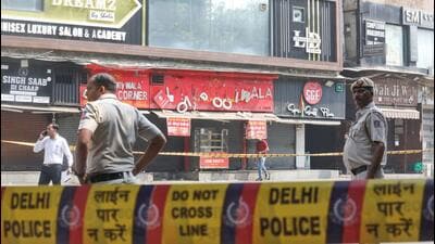 Signs of shops located in the opposite side of the blast site fell off due to the impact. (Arvind Yadav/HT Photo) Signs of shops located in the opposite side of the blast site fell off due to the impact. (Arvind Yadav/HT Photo)