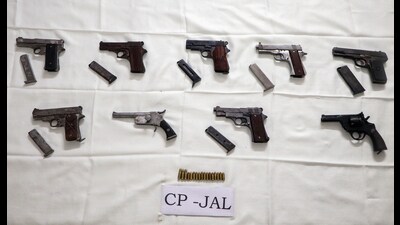 The seized weapons, along with 15 cartridges smuggled from Madhya Pradesh, in Jalandhar on Sunday. (ANI) The seized weapons, along with 15 cartridges smuggled from Madhya Pradesh, in Jalandhar on Sunday. (ANI)