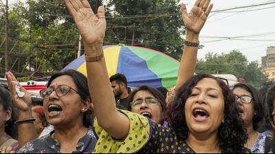 Women raise slogans near the site of junior doctors observing fast-unto-death in Kolkata on Sunday. (PTI) Women raise slogans near the site of junior doctors observing fast-unto-death in Kolkata on Sunday. (PTI)