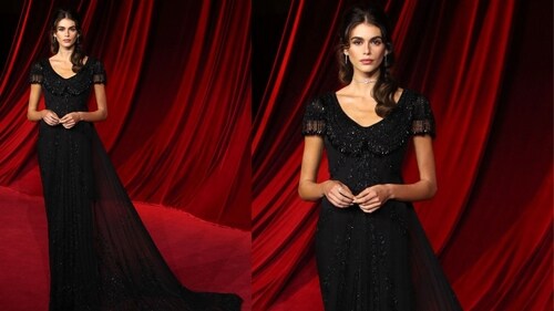 Kaia Gerber in a sheer gothic black flowy dress. Kaia Gerber in a sheer gothic black flowy dress.
