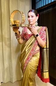 Pallavi Madhesia Yadav wearing metallic antique brass colour tissue silk saree with contrast maroon zardozdi fusion hand-work blouse and border Pallavi Madhesia Yadav wearing metallic antique brass colour tissue silk saree with contrast maroon zardozdi fusion hand-work blouse and border