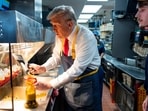 Donald Trump, left, uses a frier as an employee looks on during a visit to McDonald's in Feasterville-Trevose, Pa., Sunday, Oct. 20, 2024. (Doug Mills/The New York Times via AP, Pool) Donald Trump, left, uses a frier as an employee looks on during a visit to McDonald's in Feasterville-Trevose, Pa., Sunday, Oct. 20, 2024. (Doug Mills/The New York Times via AP, Pool)