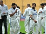 India's Virat Kohli (C) and captain Rohit Sharma (2L) walk across the field before the start of the second day play of the first Test cricket match between India and New Zealand at the M. Chinnaswamy Stadium in Bengaluru on October 17 India's Virat Kohli (C) and captain Rohit Sharma (2L) walk across the field before the start of the second day play of the first Test cricket match between India and New Zealand at the M. Chinnaswamy Stadium in Bengaluru on October 17