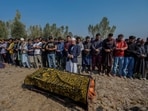 Villagers offer funeral prayers near the body of Kashmiri doctor Shahnawaz who was killed in the Gagangir terror attack