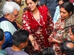 J&K L-G Manoj Sinha meets the family of Ganderbal terror attack victim Shashi Abrol, in Jammu on Monday. (PTI)
