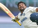 Sarfaraz Khan celebrates after scoring a century against New Zealand in Bengaluru on Saturday. Sarfaraz Khan celebrates after scoring a century against New Zealand in Bengaluru on Saturday.