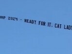During her Miami concert, a plane carried a pro-Trump banner, showcasing the ongoing conflict between the singer and the former president amidst her Eras Tour. During her Miami concert, a plane carried a pro-Trump banner, showcasing the ongoing conflict between the singer and the former president amidst her Eras Tour.