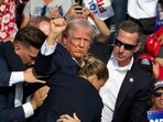 Donald Trump was hit in the ear in an apparent assassination attempt by a gunman at a campaign rally on Saturday, in a chaotic and shocking incident that will fuel fears of instability ahead of the 2024 US presidential election. (Photo by Rebecca DROKE / AFP)