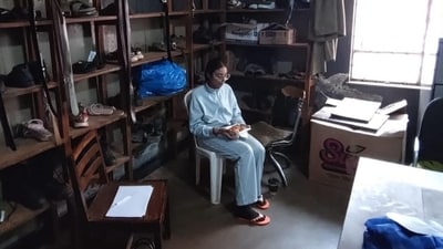 Vasundhara Oswal sits among shoes while detained in Uganda. (Instagram/@vasundharaoswal)