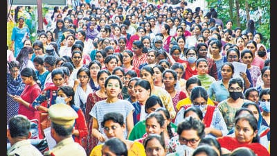 Candidates wait before appearing for the Group-1 services Mains examination conducted by the Telangana State Public Service Commission, in Hyderabad on Monday. (PTI) Candidates wait before appearing for the Group-1 services Mains examination conducted by the Telangana State Public Service Commission, in Hyderabad on Monday. (PTI)