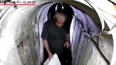 A screengrab from a handout video shows what the Israeli Army says is recently killed Hamas leader Yahya Sinwar walking through a tunnel. (Reuters)