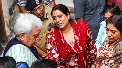 J&K L-G Manoj Sinha meets the family of Ganderbal terror attack victim Shashi Abrol, in Jammu on Monday. (PTI) J&K L-G Manoj Sinha meets the family of Ganderbal terror attack victim Shashi Abrol, in Jammu on Monday. (PTI)