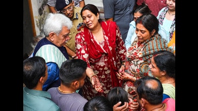 J&K L-G Manoj Sinha meets the family of Ganderbal terror attack victim Shashi Abrol, in Jammu on Monday. (PTI) J&K L-G Manoj Sinha meets the family of Ganderbal terror attack victim Shashi Abrol, in Jammu on Monday. (PTI)