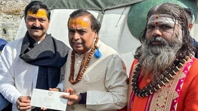 Reliance Industries Chairman Mukesh Ambani gives a cheque of Rs. 5.02 crore to Badarinath-Kedarnath Temple Committee President Ajendra Ajay. (Virender Singh Negi) Reliance Industries Chairman Mukesh Ambani gives a cheque of Rs. 5.02 crore to Badarinath-Kedarnath Temple Committee President Ajendra Ajay. (Virender Singh Negi)