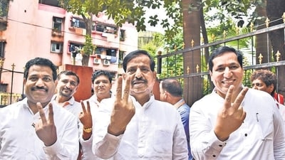 Navi Mumbai, India - October 24, 2019: (L to R): Sanjeev Naik, BJP Candidate Ganesh Naik and Sandeep Naik shows voctory sign before entering Vote Counting Center at Airoli in Navi Mumbai, India, on Thursday, October 24, 2019. (Photo by Bachchan Kumar/ Hindustan Times) (Hindustan Times) Navi Mumbai, India - October 24, 2019: (L to R): Sanjeev Naik, BJP Candidate Ganesh Naik and Sandeep Naik shows voctory sign before entering Vote Counting Center at Airoli in Navi Mumbai, India, on Thursday, October 24, 2019. (Photo by Bachchan Kumar/ Hindustan Times) (Hindustan Times)
