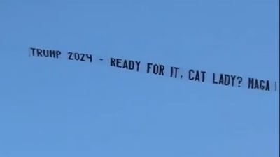 During her Miami concert, a plane carried a pro-Trump banner, showcasing the ongoing conflict between the singer and the former president amidst her Eras Tour. (@TONYxTWO/X) During her Miami concert, a plane carried a pro-Trump banner, showcasing the ongoing conflict between the singer and the former president amidst her Eras Tour. (@TONYxTWO/X)