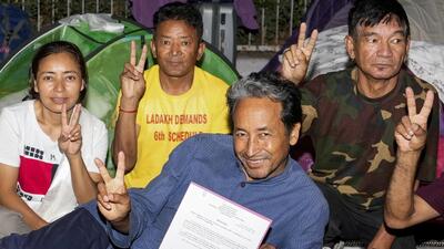 Sonam Wangchuk and his supporters flash victory sign after ending their fast. (PTI) Sonam Wangchuk and his supporters flash victory sign after ending their fast. (PTI)