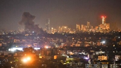TOPSHOT - Smoke rises from areas targeted by an Israeli airstrike in Beirut�s southern suburbs late on October 21, 2024. Lebanese state media reported Israeli strikes on Hezbollah's south Beirut bastion including for the first time on the Ouzai district on October 21, 2024, shortly after the Israeli army warned residents of several districts to evacuate. (Photo by Fadel ITANI / AFP) TOPSHOT - Smoke rises from areas targeted by an Israeli airstrike in Beirut�s southern suburbs late on October 21, 2024. Lebanese state media reported Israeli strikes on Hezbollah's south Beirut bastion including for the first time on the Ouzai district on October 21, 2024, shortly after the Israeli army warned residents of several districts to evacuate. (Photo by Fadel ITANI / AFP)