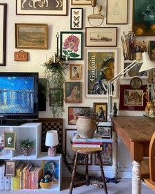 Mismatched furniture, sentimental keepsakes, books, plants, and eclectic decor fill the space, creating a visually rich environment full of personality. Mismatched furniture, sentimental keepsakes, books, plants, and eclectic decor fill the space, creating a visually rich environment full of personality.