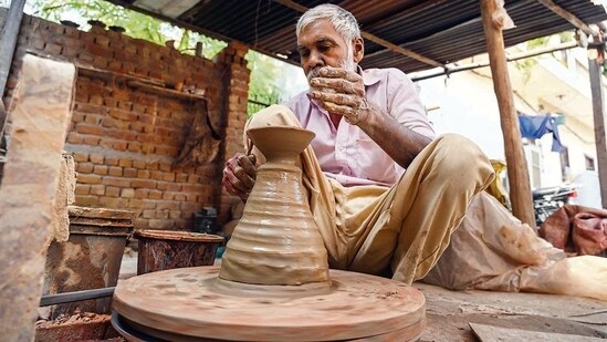 This potter in Gurugram is making almost five thousand diyas everyday ahead of Diwali. (Photo: Parveen Kumar/HT)