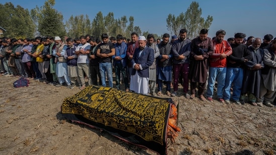 Villagers offer funeral prayers near the body of Kashmiri doctor Shahnawaz who was killed in the Gagangir terror attack (AP)