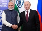 Prime Minister Narendra Modi and Russian president Vladimir Putin shake hands during their meeting on the sidelines of BRICS Summit at Kazan Kremlin in Kazan, Russia.