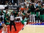 Boston Celtics' Jaylen Brown dunks the ball