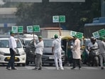 Placards being held during the launch of 'Red Light On, Gaadi Off campaign' to curb air pollution at ITO crossing in New Delhi on Monday. (Photo by RAJ K RAJ / Hindustan Times)