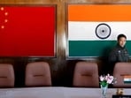 File photo of a man walking inside a conference room, used for meetings between military commanders of China and India, on the Indian side of the Indo-China border at Bumla in Arunachal Pradesh in November 2009.
