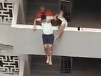 The man was pulled back in by residents (Screengrab from video)