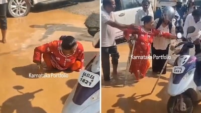 Bengaluru rain: The image shows passersby helping a physically challenged woman who fell in a waterlogged street. (X/@karnatakaportf) Bengaluru rain: The image shows passersby helping a physically challenged woman who fell in a waterlogged street. (X/@karnatakaportf)