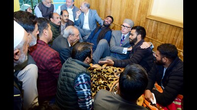 Jammu and Kashmir chief minister Omar Abdullah offers condolence to the family members of Dr Shanawaz Dar, who was killed in the recent 'Gagangir terror attack', in Budgam on Tuesday. (ANI)