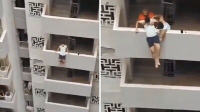 The image shows neighbours saving a man who tried jumping from a Noida high rise. (Screengrab) The image shows neighbours saving a man who tried jumping from a Noida high rise. (Screengrab)