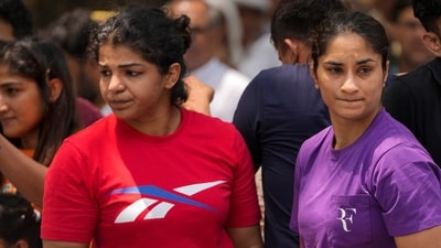 Wrestlers Vinesh Phogat and Sakshi Malik with supporters during their protest against Wrestling Federation of India (WFI) chief Brij Bhushan Sharan Singh. (PTI) Wrestlers Vinesh Phogat and Sakshi Malik with supporters during their protest against Wrestling Federation of India (WFI) chief Brij Bhushan Sharan Singh. (PTI)