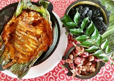 Karimeen Pollichathu (Pearl Spot fish cooked in Banana Leaf) is one a traditional delicacy of Kerala Karimeen Pollichathu (Pearl Spot fish cooked in Banana Leaf) is one a traditional delicacy of Kerala