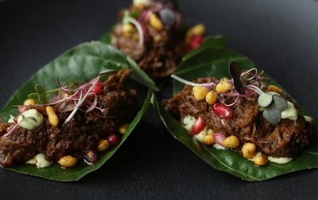 Kolhapuri slow cooked lamb on betel leaf, avocado, raita, crisp bondi (Shivam Saxena/ HT Photo)