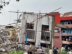 An under-construction building collapsed at Hennur amidst the ongoing heavy rainfall, in Bengaluru on Tuesday. (ANI)
