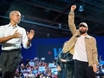 Rapper Eminem, center, greets the crowd on stage with former President Barack Obama, left, at a campaign rally supporting Democratic presidential nominee Vice President Kamala Harris, Tuesday, Oct. 22, 2024, in Detroit. (AP Photo/Paul Sancya) Rapper Eminem, center, greets the crowd on stage with former President Barack Obama, left, at a campaign rally supporting Democratic presidential nominee Vice President Kamala Harris, Tuesday, Oct. 22, 2024, in Detroit. (AP Photo/Paul Sancya)