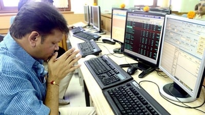 A stock trader prays in front of his trading terminal before Muhurat Trading - a special trading session on the occasion of Diwali. (AFP) A stock trader prays in front of his trading terminal before Muhurat Trading - a special trading session on the occasion of Diwali. (AFP)