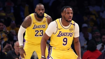 LeBron James and Bronny James of the Los Angeles Lakers on defense during the second quarter against the Minnesota Timberwolves at Crypto.com Arena (Getty Images via AFP) LeBron James and Bronny James of the Los Angeles Lakers on defense during the second quarter against the Minnesota Timberwolves at Crypto.com Arena (Getty Images via AFP)