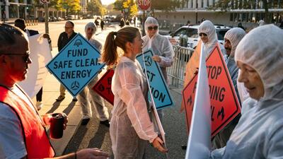 Climate activists protest against in Washington, DC, on October 21. (Bloomberg Photo) Climate activists protest against in Washington, DC, on October 21. (Bloomberg Photo)