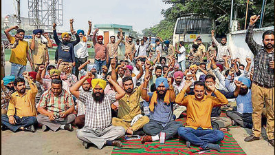 Contractual workers during the strike at Ludhiana depot on Wednesday. (Manish/HT) Contractual workers during the strike at Ludhiana depot on Wednesday. (Manish/HT)