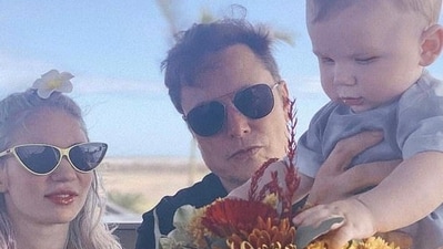 Grimes and Elon with their son. Grimes and Elon with their son.