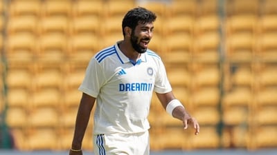 Jasprit Bumrah reacts after bowling a delivery during the day three of the first cricket test match between India and New Zealand. (AP) Jasprit Bumrah reacts after bowling a delivery during the day three of the first cricket test match between India and New Zealand. (AP)