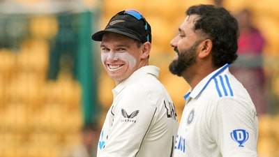 Bengaluru: India's Rohit Sharma and New Zealand's Tom Latham enter the ground for the national anthem. (PTI) Bengaluru: India's Rohit Sharma and New Zealand's Tom Latham enter the ground for the national anthem. (PTI)