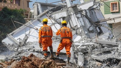 NDRF personnel during a rescue operation after an under-construction building collapsed in Bengaluru. (PTI) NDRF personnel during a rescue operation after an under-construction building collapsed in Bengaluru. (PTI)