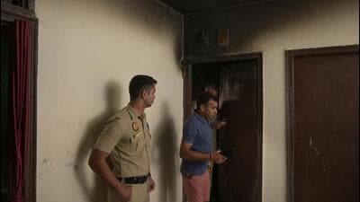 Police investigate the spot of the fire. (HT Photo) Police investigate the spot of the fire. (HT Photo)