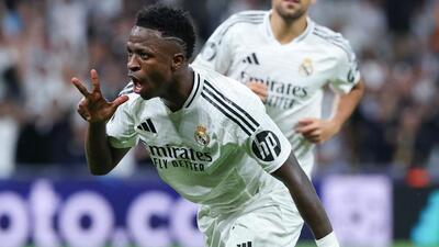 Real Madrid's Vinicius Junior celebrates scoring a hat-trick against Borussia Dortmund in Madrid on Tuesday. (AFP)